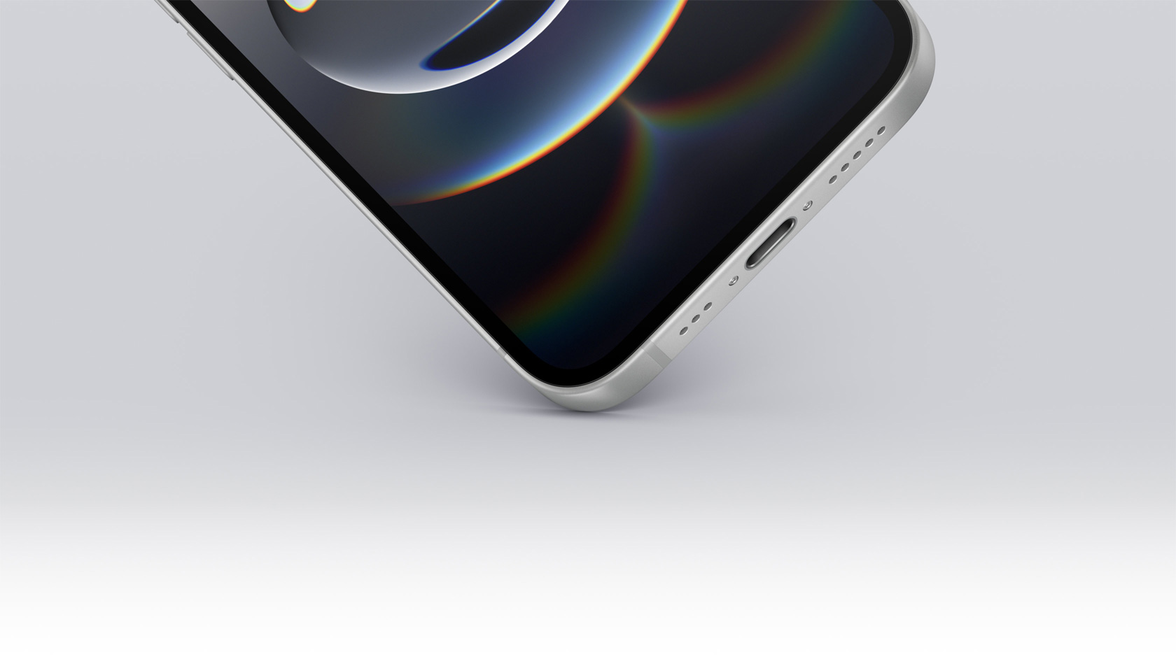 Det ene hjørne i bunden af iPhone 16e rører jorden, og USB-C-porten vises.